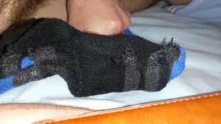 Twink cumming a big load onto some sports socks after gym