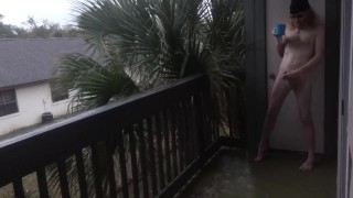 Nudist enjoys his morning wood with coffee on the balcony