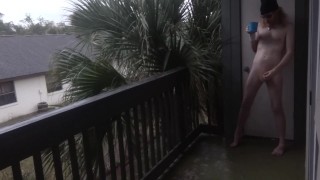 Nudist enjoys his morning wood with coffee on the balcony