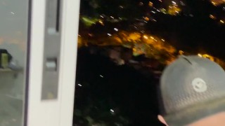 I show off in front of a window in Medellin