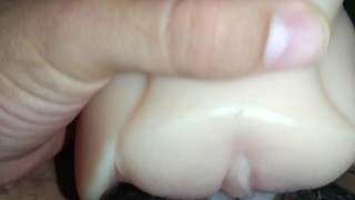 Young man touching himself with a toy at home