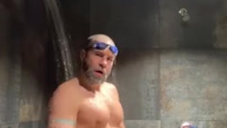 Bearded Swimmer pissing in locker room