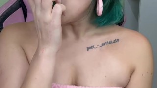 Green haired girl makes it all disappear inside her mouth