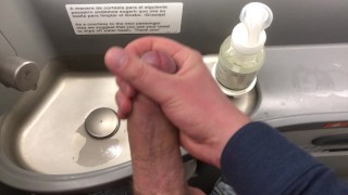 Big dick jerked off in airplane toilet