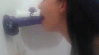 Sucking purple suction cup dildo in tub