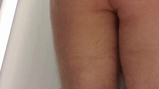 Femboy tries on women's blouse and skirt in store fitting room