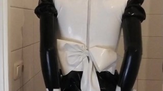 Latex maid uniform dress with black rubber skirt, red bow, frilly stockings and mask wetsuiterest