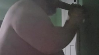 Fat male in chastity sucking off 12 inch dildo
