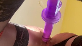 girl in stockings fucks herself with a dildo and cums loudly