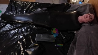 Cocooned in Latex and Teased with Buzzing Toys - rubber sack + toys + hood = HORNY!