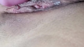 She’s gripping her thighs, struggling to hold back