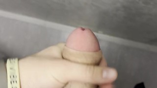 young twink touches his dick in public toilet