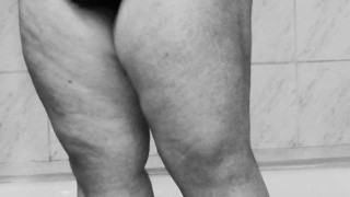 Chubby MILF shaves her pussy in the shower - black and white