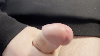 young twink has already stained his sweatshirt with cum and continues to jerk off in the office