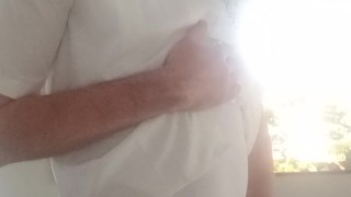 В боди и колготках в сеточку у телевизора