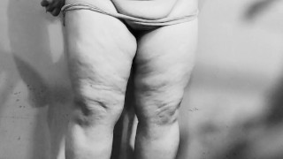 Chubby MILF strips naked in the basement, showing off her big ass and curvy figure