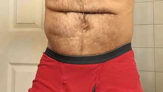 HAIRY MUSCLE BEAR FLEXING IN RED BOXER BRIEFS