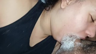the bitch's nervous tongue goes deep, licking and bubbling all the spit on the dick