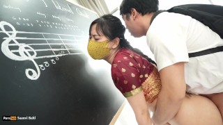 Indian Teacher play Violin Lessons in her class room