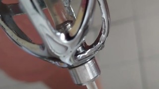 Piss in the penis cage with catheter in tights