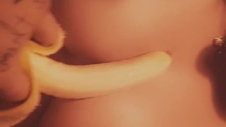 Kitty eats banana
