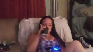 Sexy long hair brunette bbw eating pizza and smoking cigarettes while playing video games