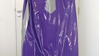 Putting on latex saint priest robe coat gown over schoolgirl sailor uniform and rubber skirt layers