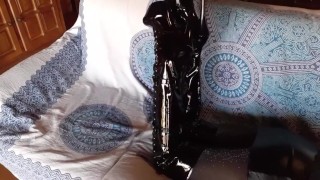 Total black with fishnets pantyhose and boots over the knee