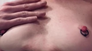 Slow motion playing of my pierced small tits propped up by my tight corset