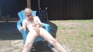 Nudist basks in the sun with his cock and ass out for display