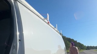 Checking why back van door rattling. Side of the road. Naked.