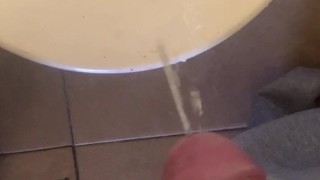 taking a long piss with a boner