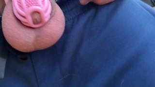 Caged cuck flashes while walking in woods