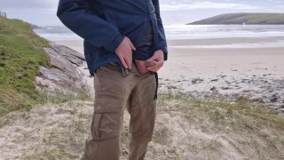 Pissing In Public. Taking A Piss On The Deserted Island Beach.