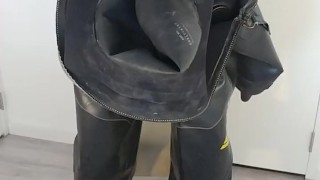 Putting on heavy rubber Viking drysuit, gasmask, latex mask and condom