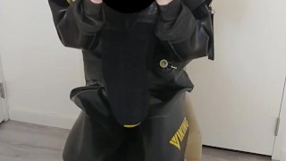 Putting on heavy rubber Viking drysuit, gasmask, latex mask and condom